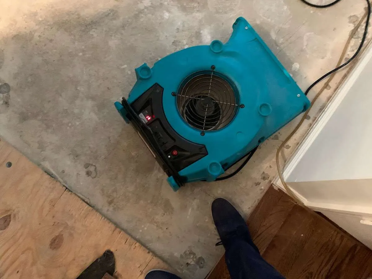 Air mover drying subfloor during Commercial Water Damage Restoration in Hainesport